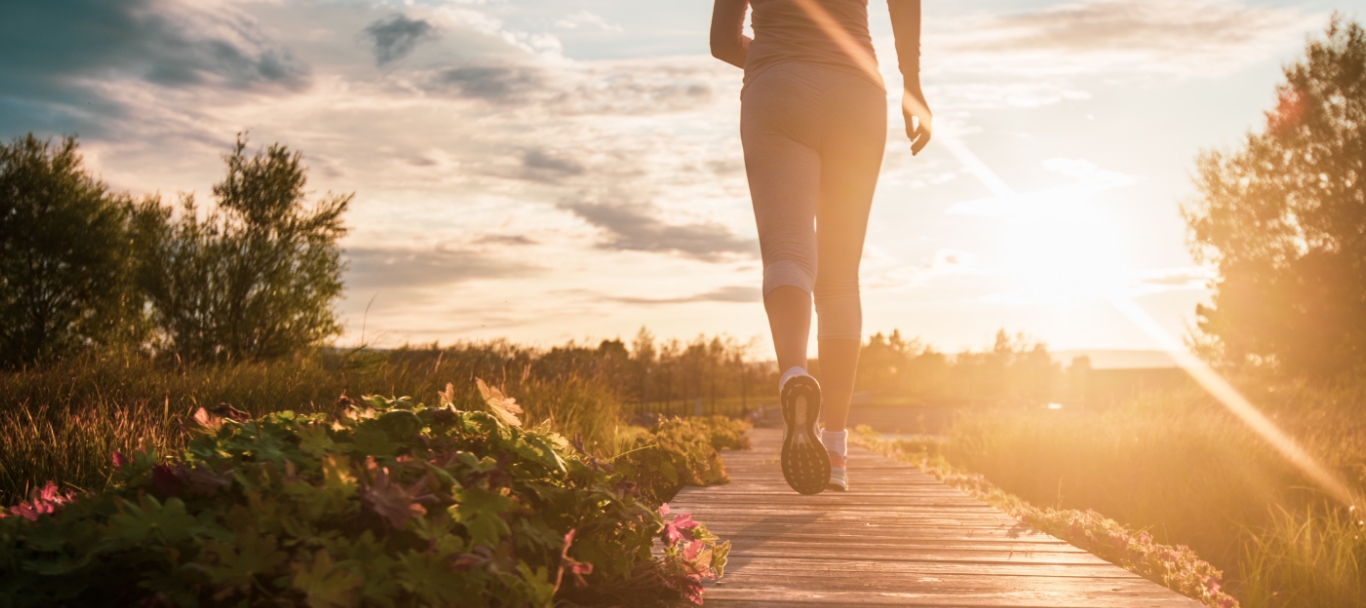 Blonde woman jogging, outdoors in nature