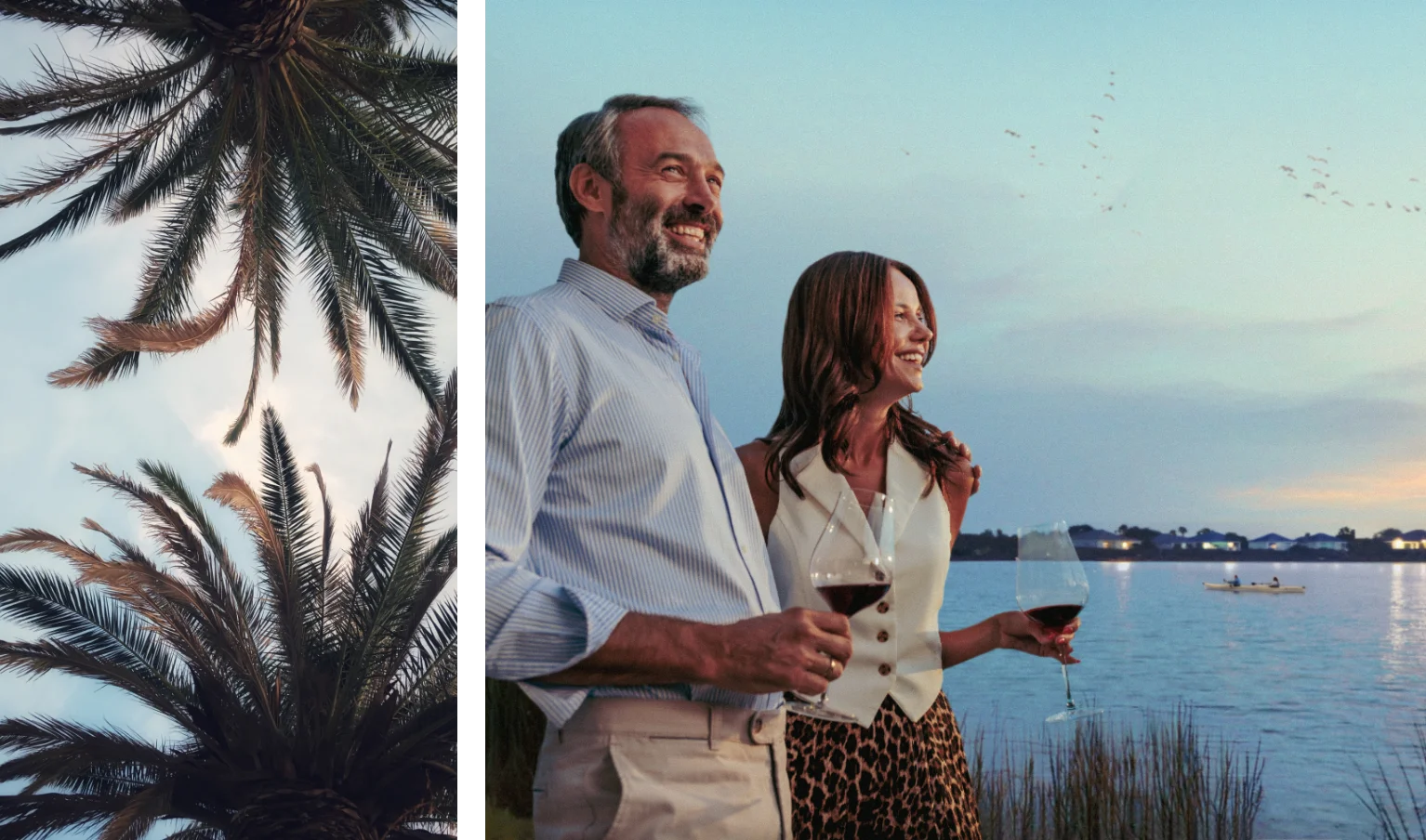 Smiling mature couple enjoying a glass of wine by an infinity pool at sunset, looking at the view