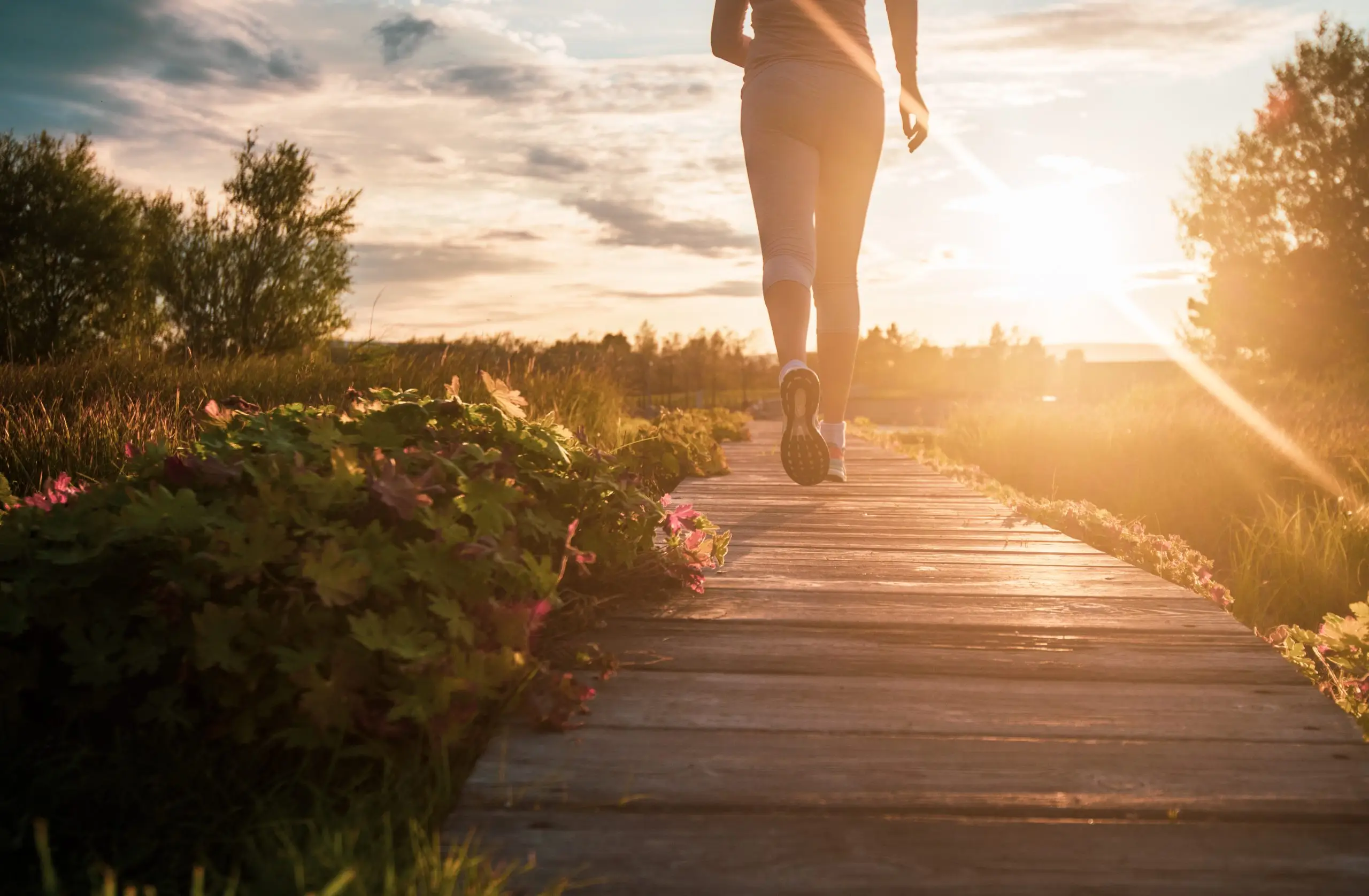 Blonde woman jogging, outdoors in nature